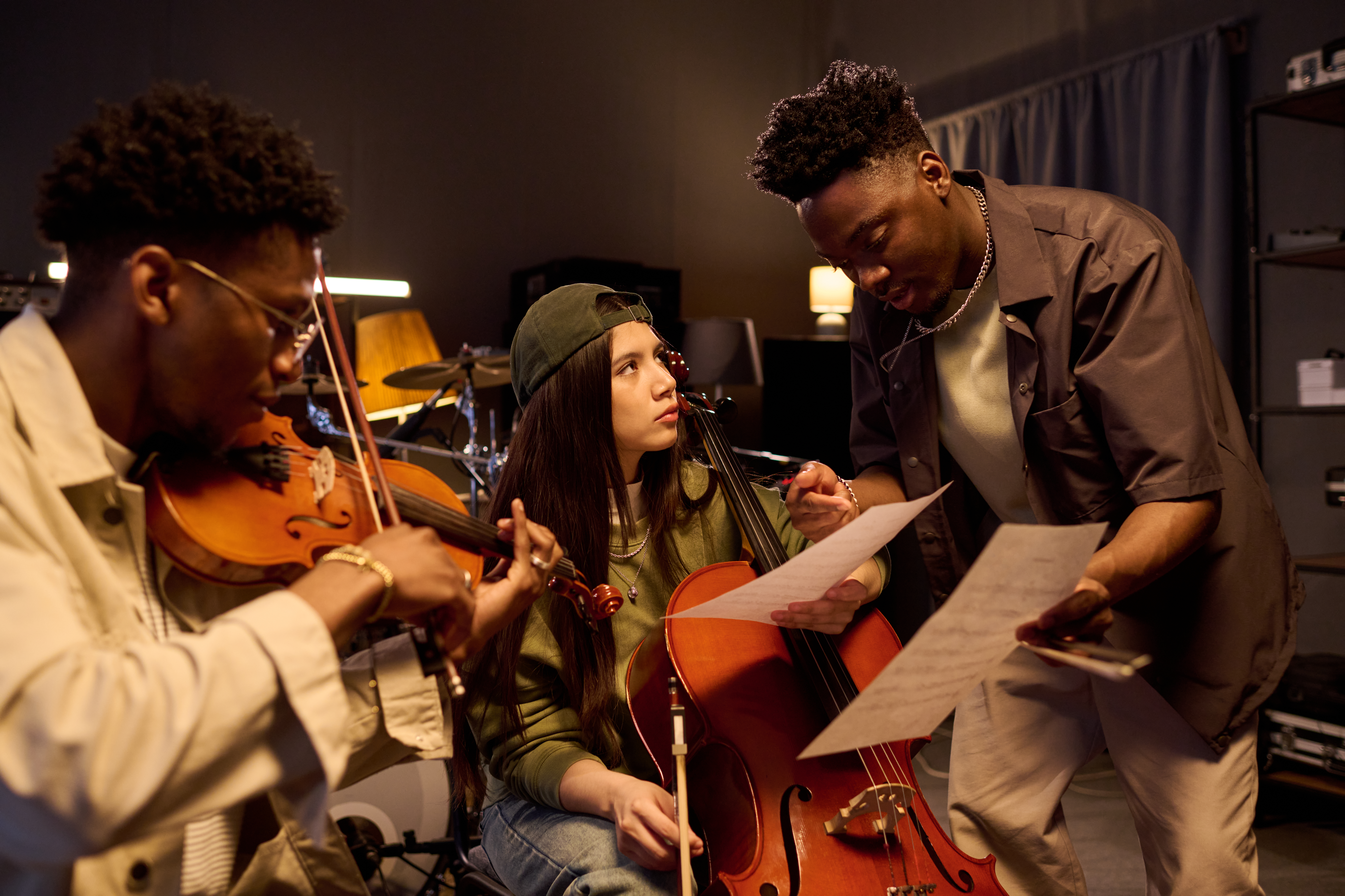 Multiethnic Musicians Rehearsing Classical Music Together in Studio